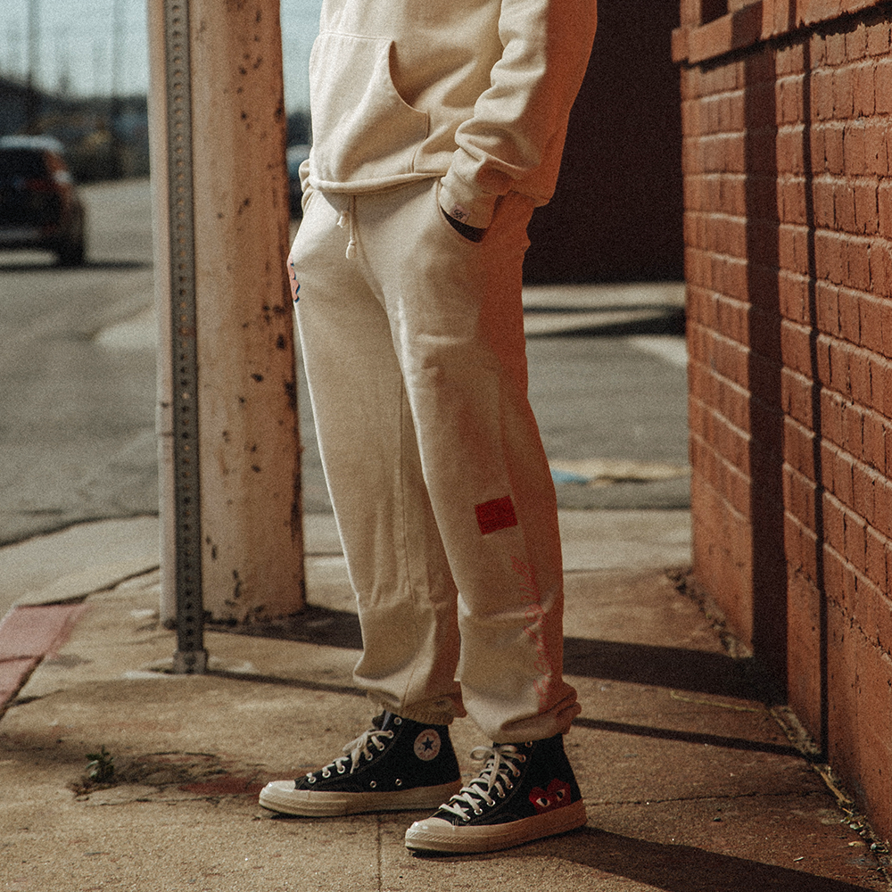 Cream sweatpants sales